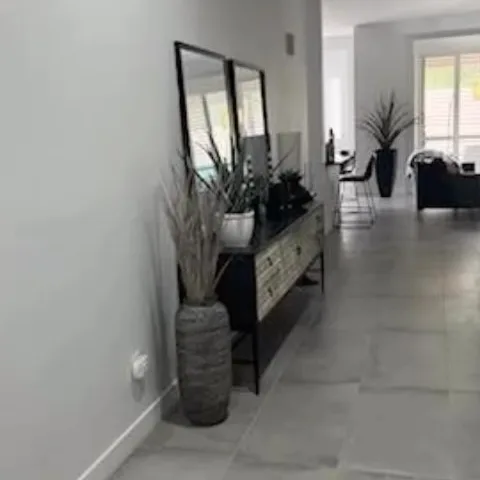 So fun to  work with this  client who had definitive design ideas but we helped her pull it all together , 24x32  cement  look tile  floors , black quartz countertops , remodeled l