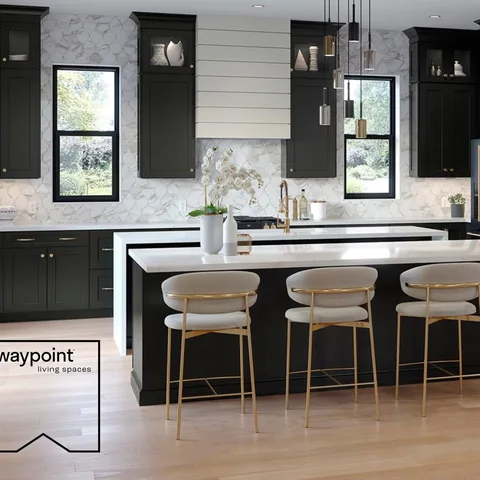 Light walls and countertops paired with bold dark kitchen cabinets are an elegant and flawless way to add dimension and subtle visual interest to your space.