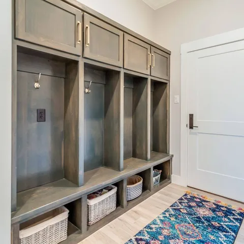 Summer = high traffic. Focus on 'hot spots' like entryways, mudrooms, and coffee tables.