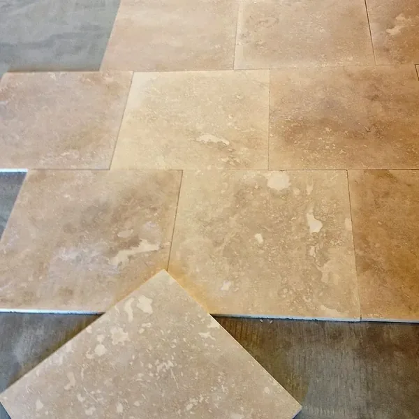 Natural stone floor tile with warm color variation – Flooring Installation in Sun City West, AZ