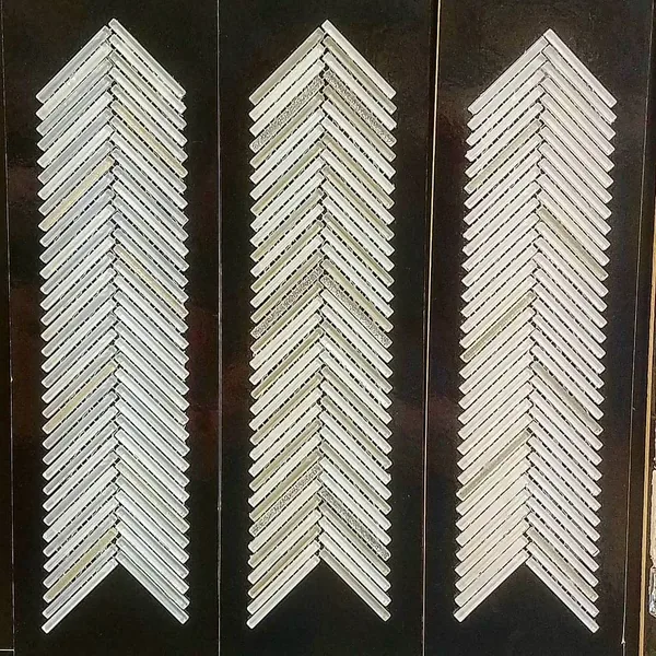 Chevron mosaic tile samples with contrasting light and dark finishes
