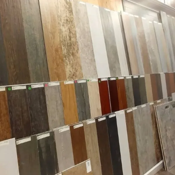 Showroom display of wood-look plank tile in light and dark finishes